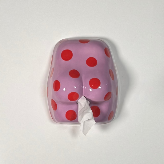 Purple butt shaped tissue dispenser with red polka dots