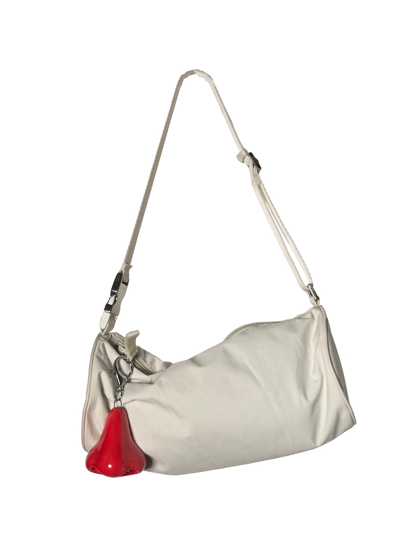 Silver handbag with a red nose keychain on a white background