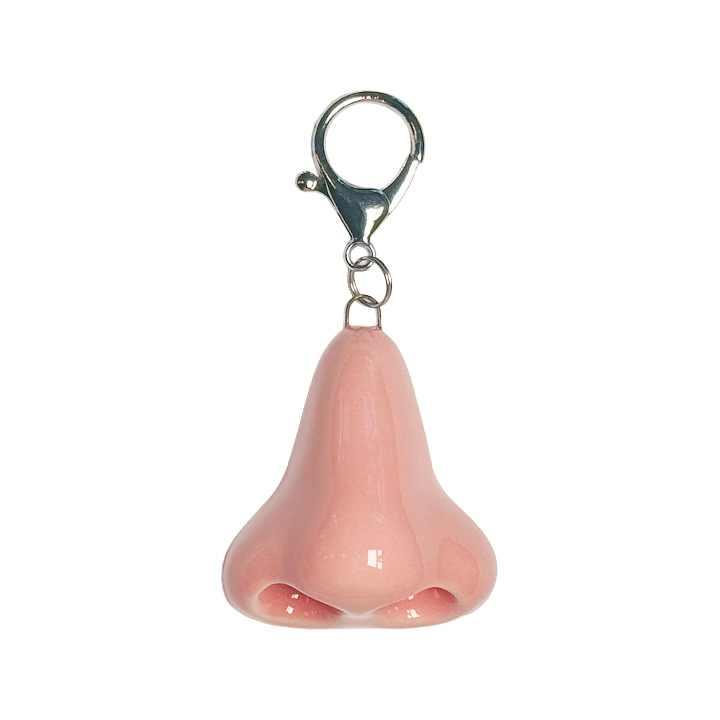 Pink nose-shaped keychain on a white background