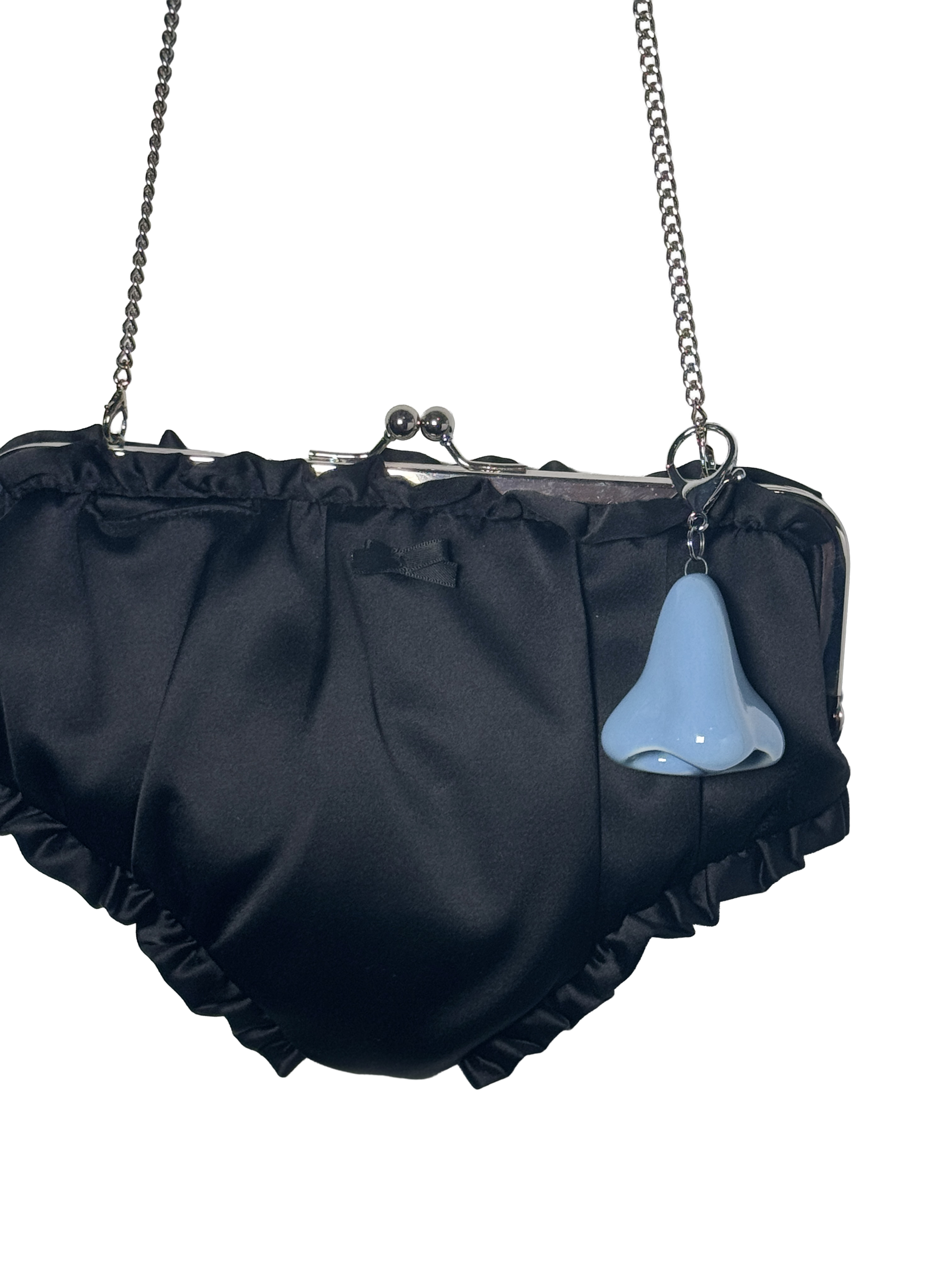 Black ruffled handbag with a blue nose charm on a white background