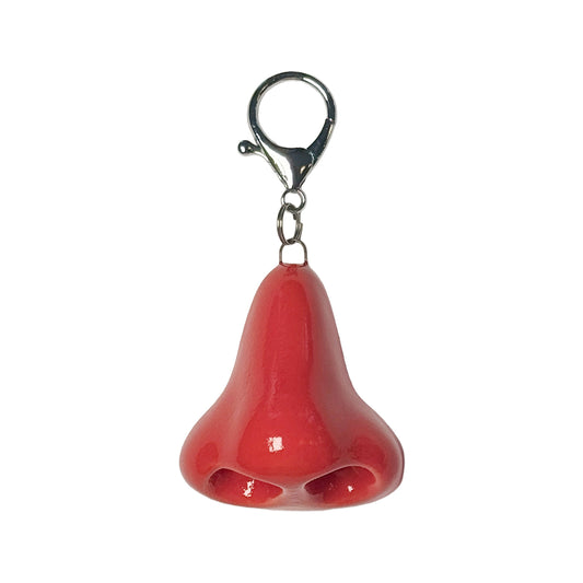 Red nose keychain with a silver clip on a white background